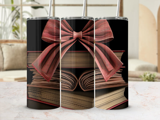 Three stacked books with a red bow, a tumbler design.