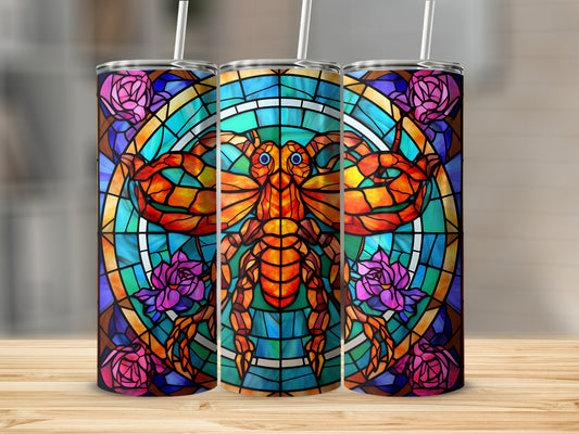 Stained glass tumbler with a scorpion and flower design.