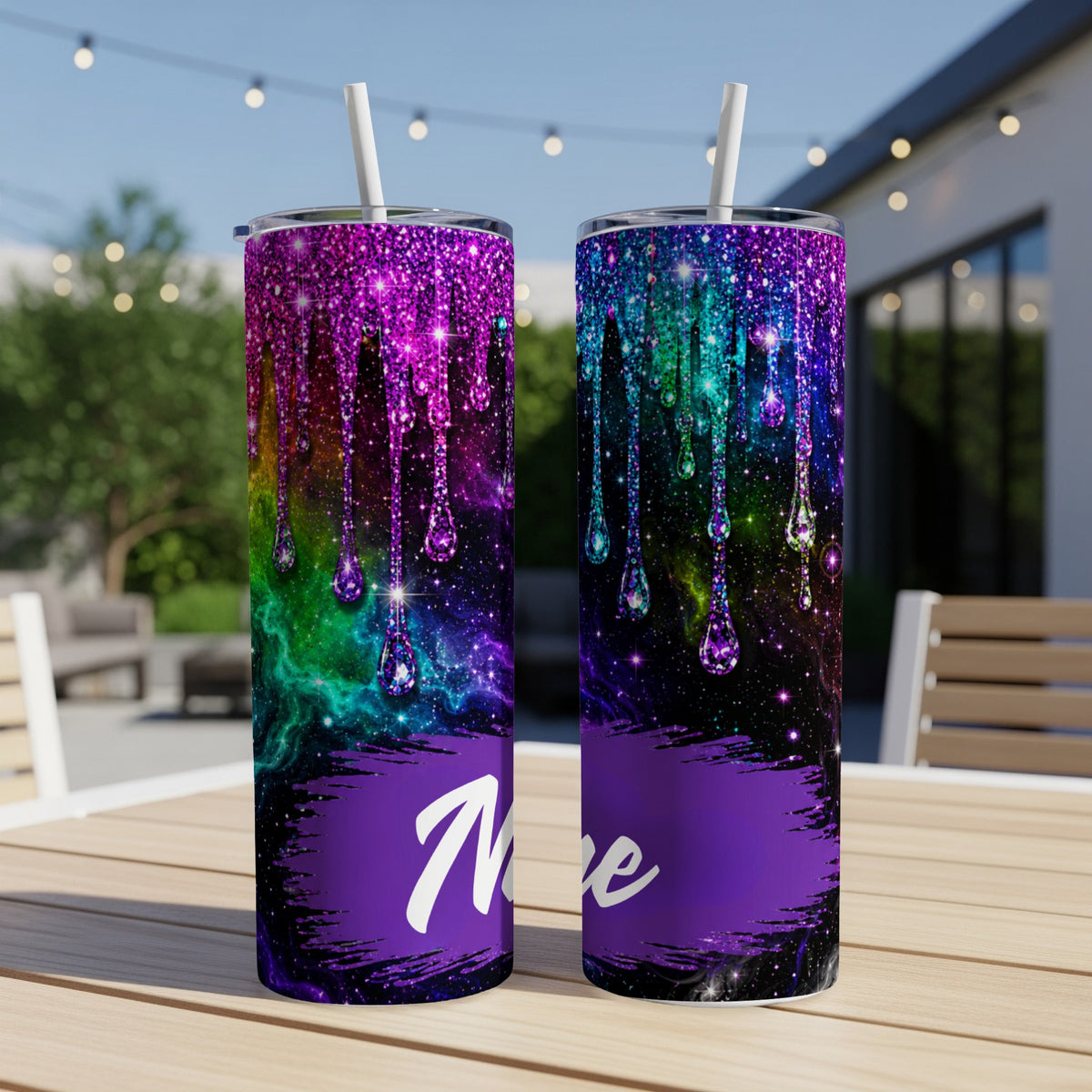 Two tumblers with dripping galaxy glitter design and a purple brushstroke with the word "Nieve"