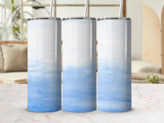 Three tall, skinny tumblers with a watercolor blue design.