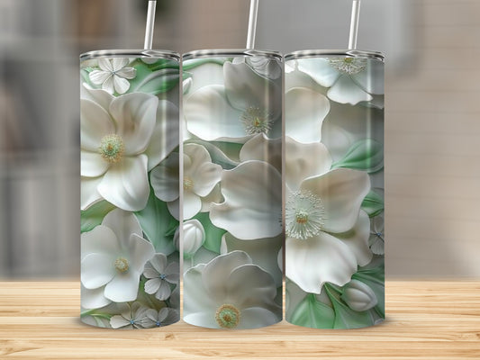 Three tumblers with white floral patterns against a blurred background.