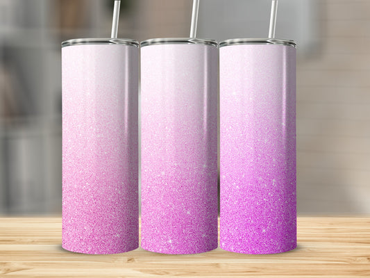 Three tall tumblers with a pink glitter ombre design and white straws.