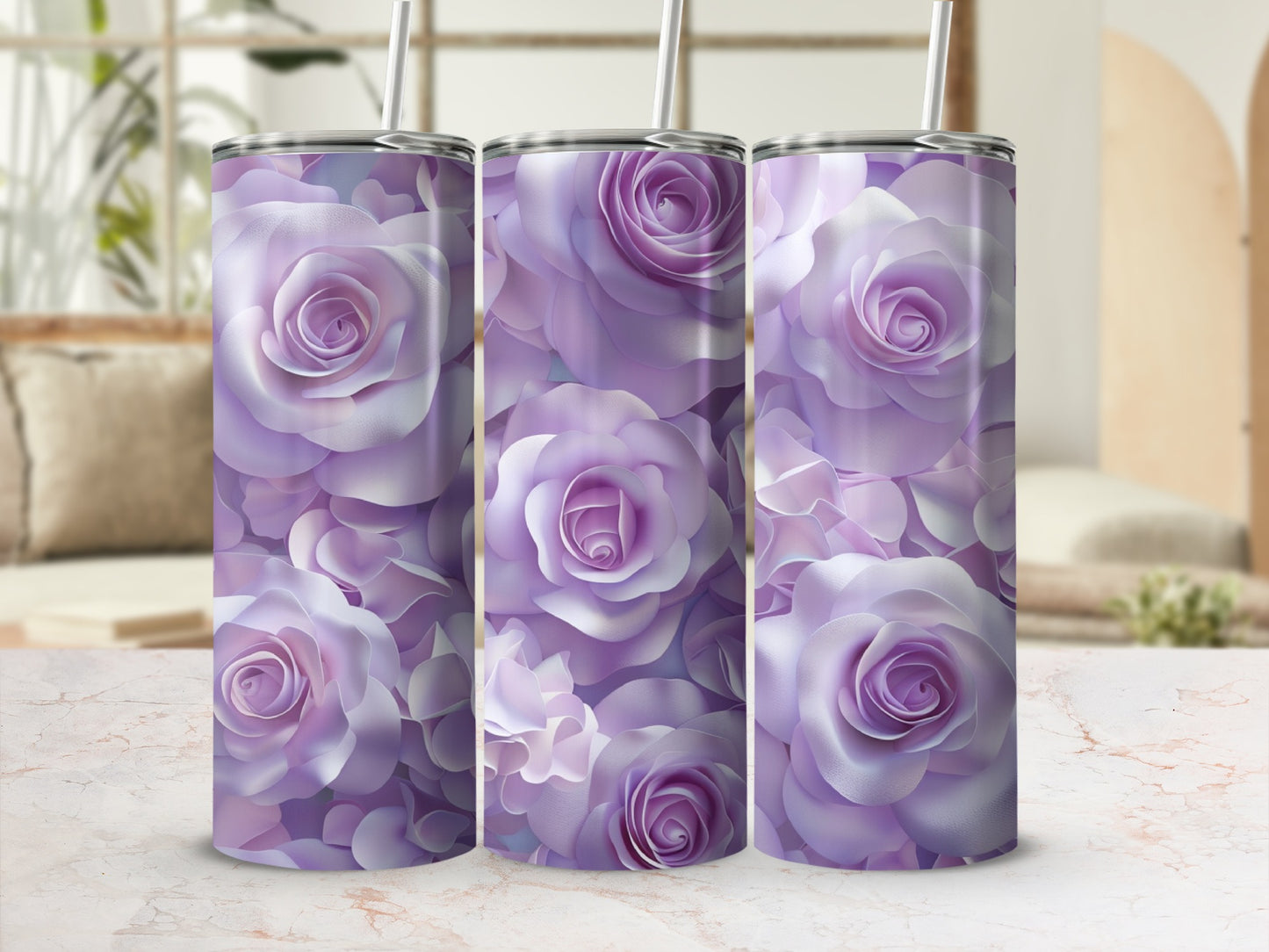 Three purple rose patterned tumblers with straws on a marble surface.
