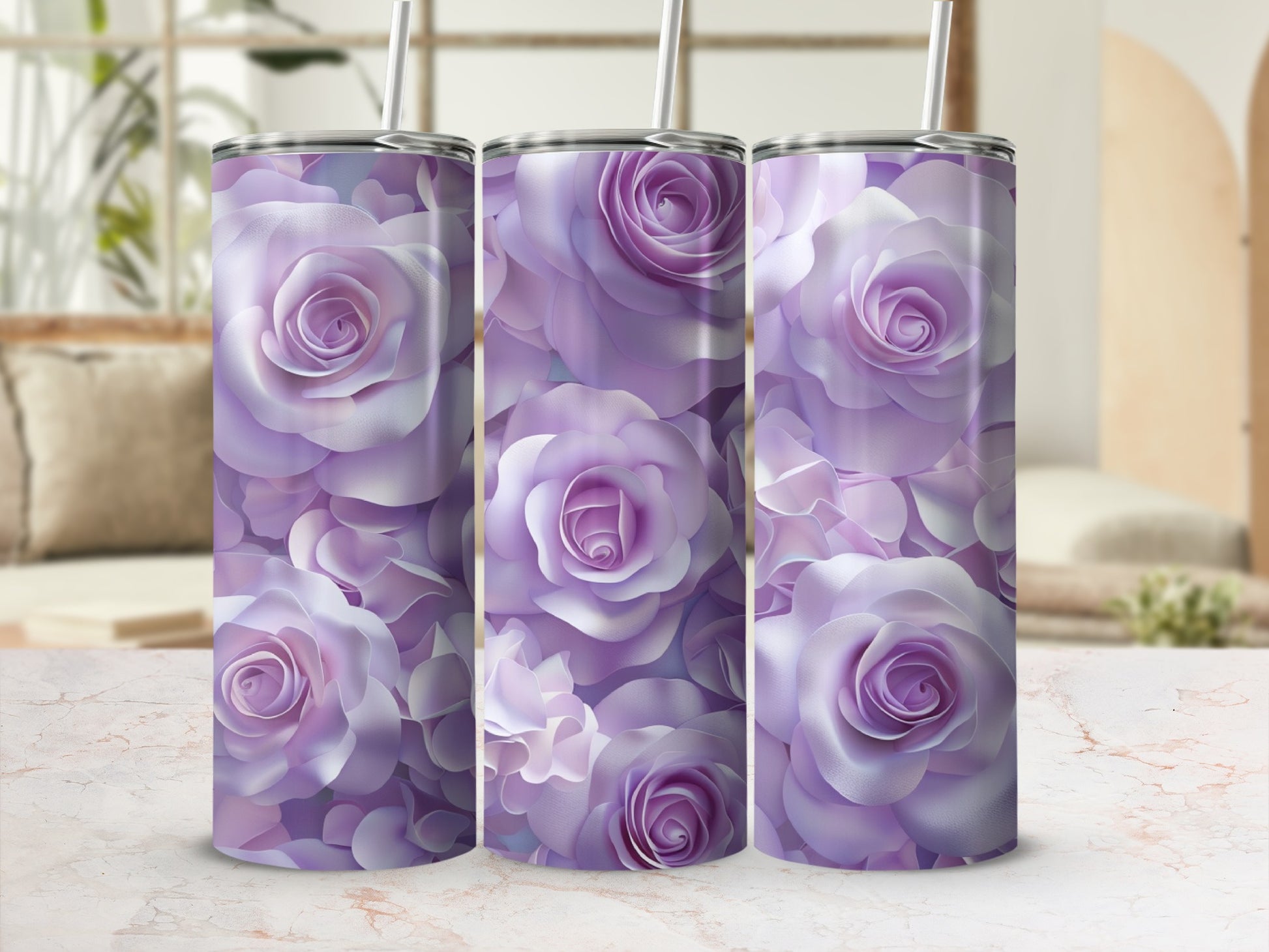 Three purple rose patterned tumblers with straws on a marble surface.