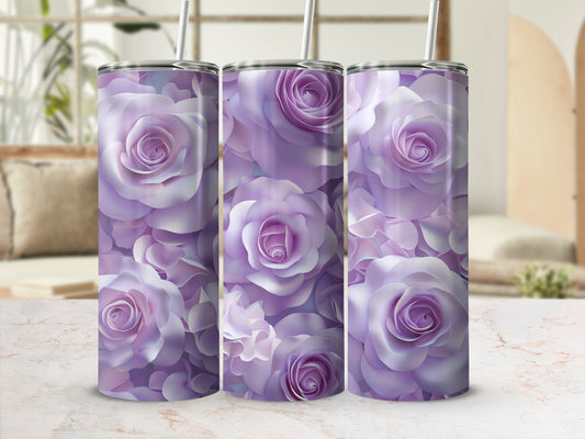 Three purple rose patterned tumblers with straws on a marble surface.