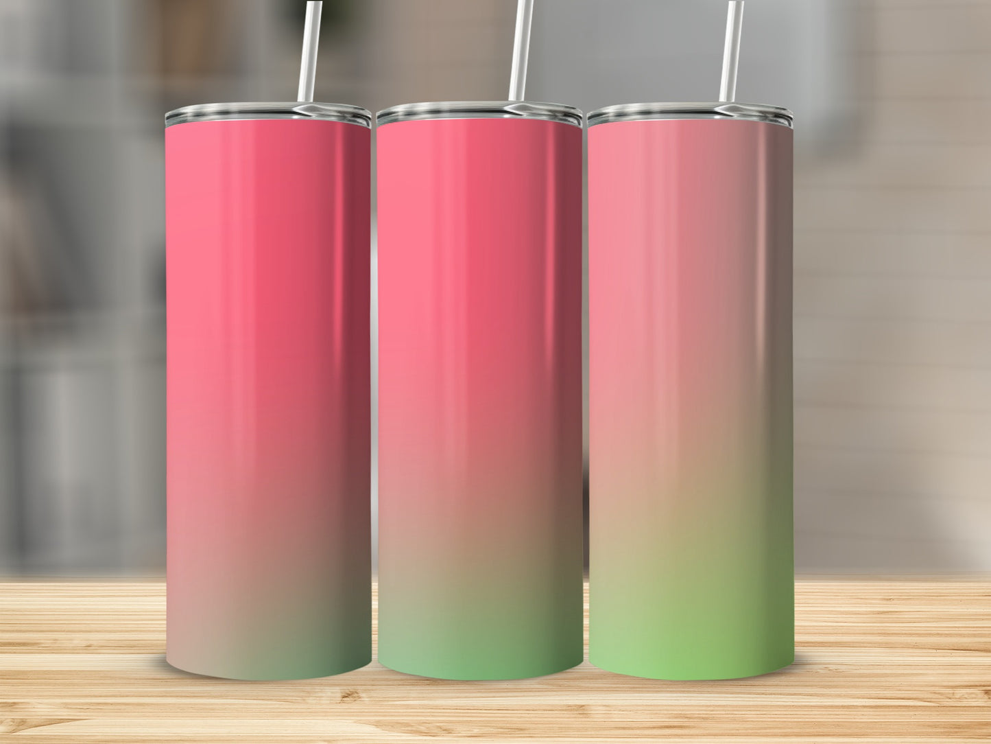 Three tall tumblers with pink to green gradient design and white straws.