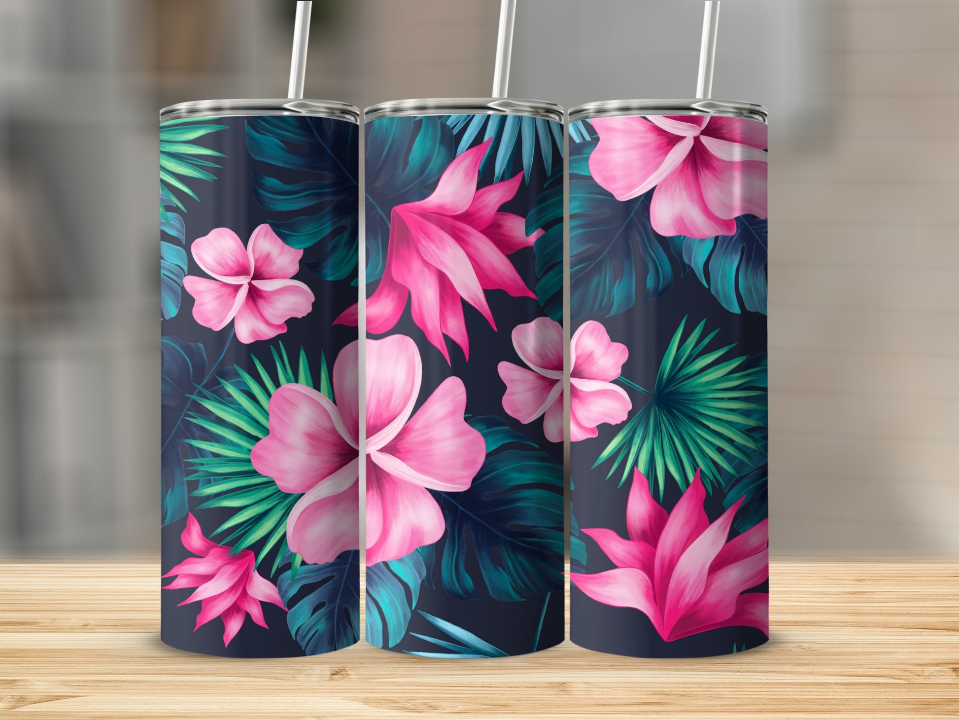 Three tumblers with a dark blue background and bright pink tropical flowers and green leaves.