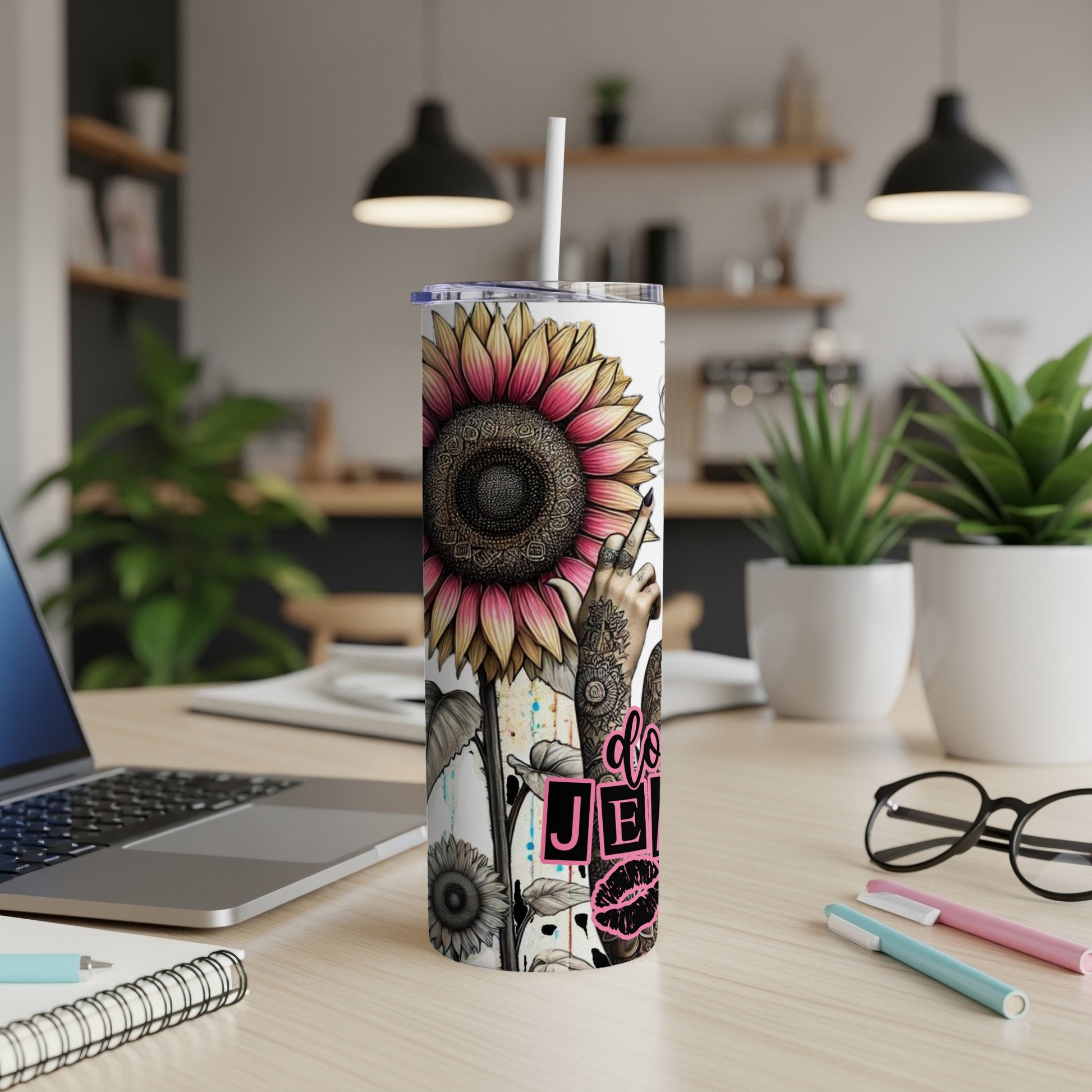 Tall tumbler with a sunflower, peace sign hand, and "do good" text.