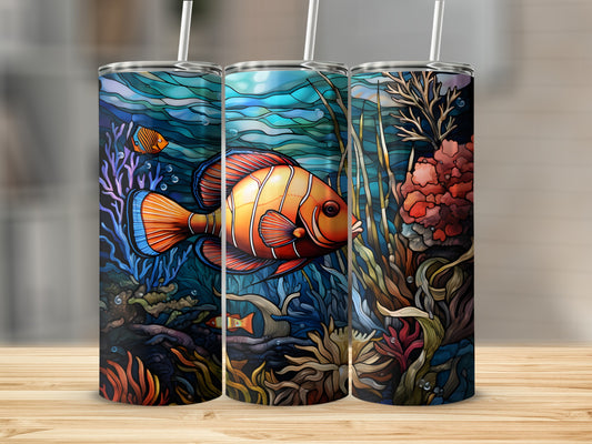 Three tumblers with clownfish and coral reef underwater scene.