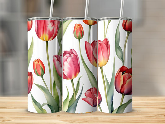 Three white tumblers with a floral pattern of red and pink tulips.