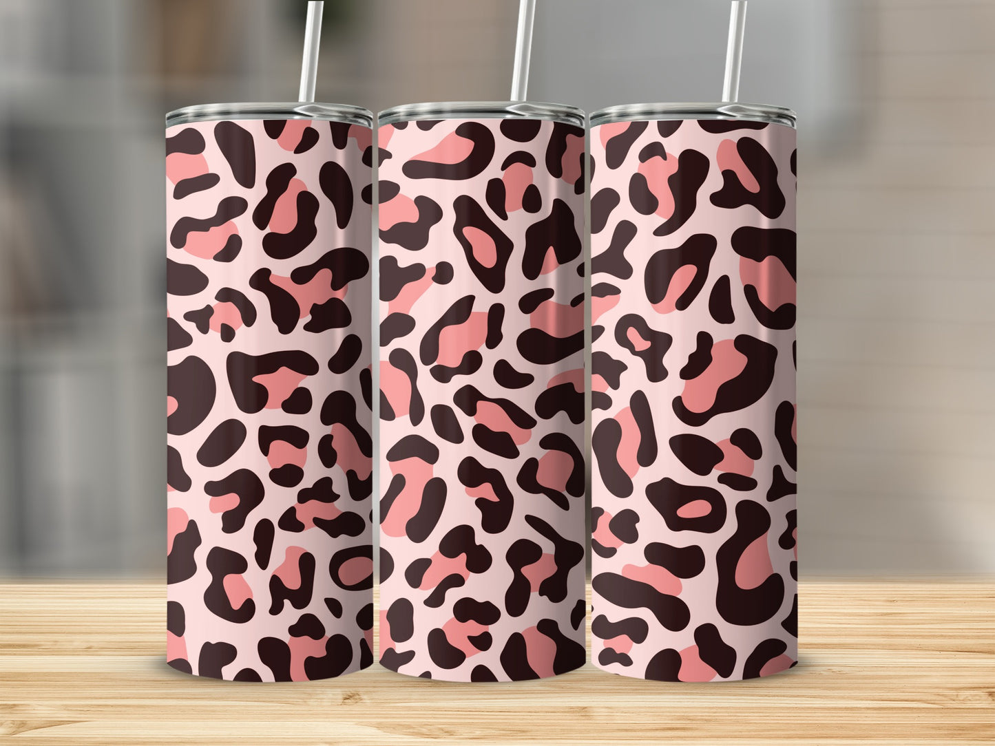 Three tumblers with a pink and brown leopard print pattern.