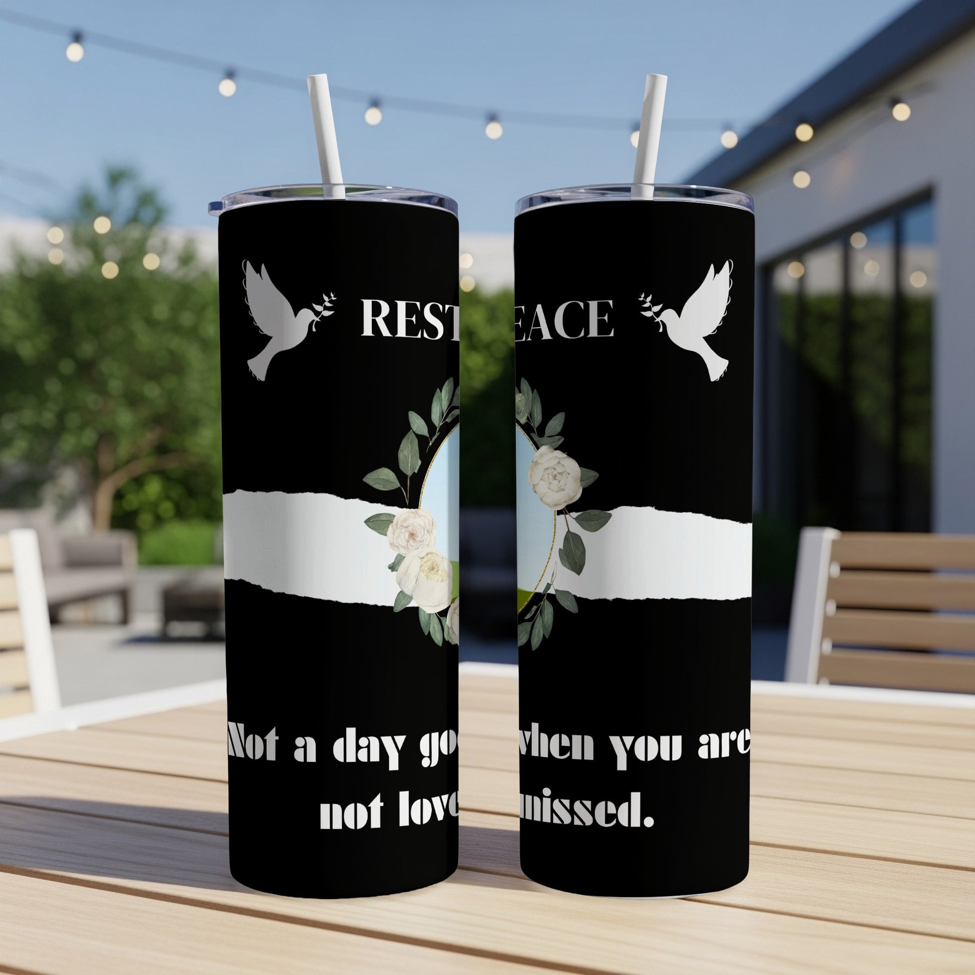 Black tumblers with white doves, roses, and text "Rest in Peace" and "Not a day goes by you are not loved or missed."