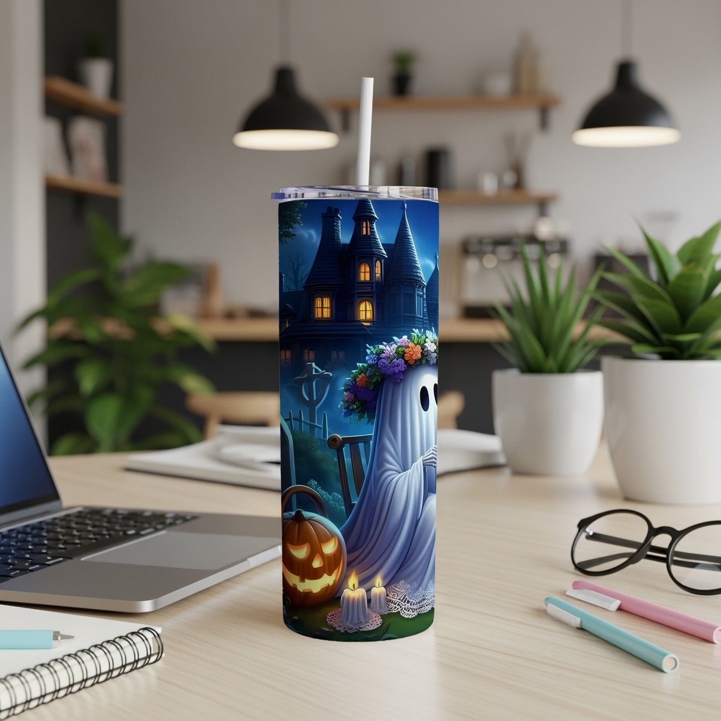 Tumbler with ghost, pumpkin, candles, and spooky house Halloween design.