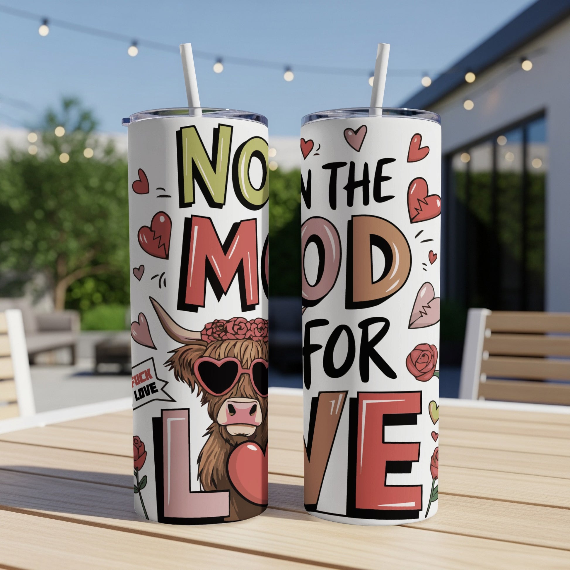 Two tumblers with "Now in the mood for love" text and cow graphic.