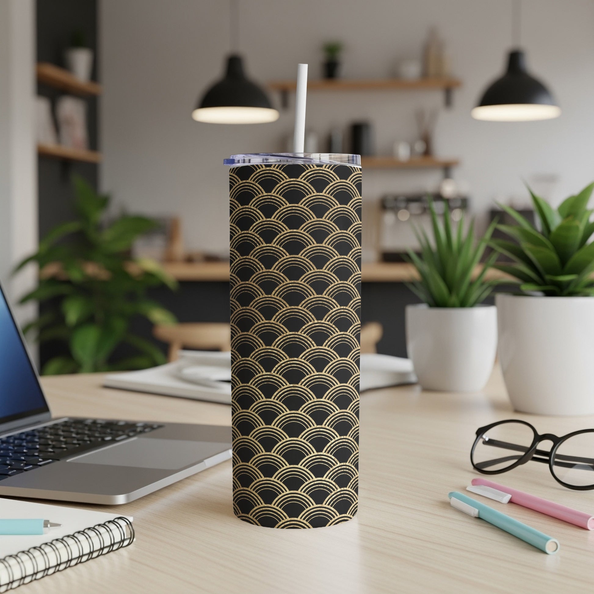 Black tumbler with gold Art Deco wave pattern and white straw.