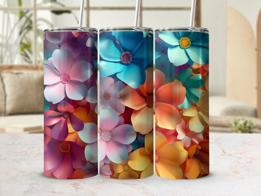 Three tumblers with colorful floral patterns, one pink, one blue, one orange.