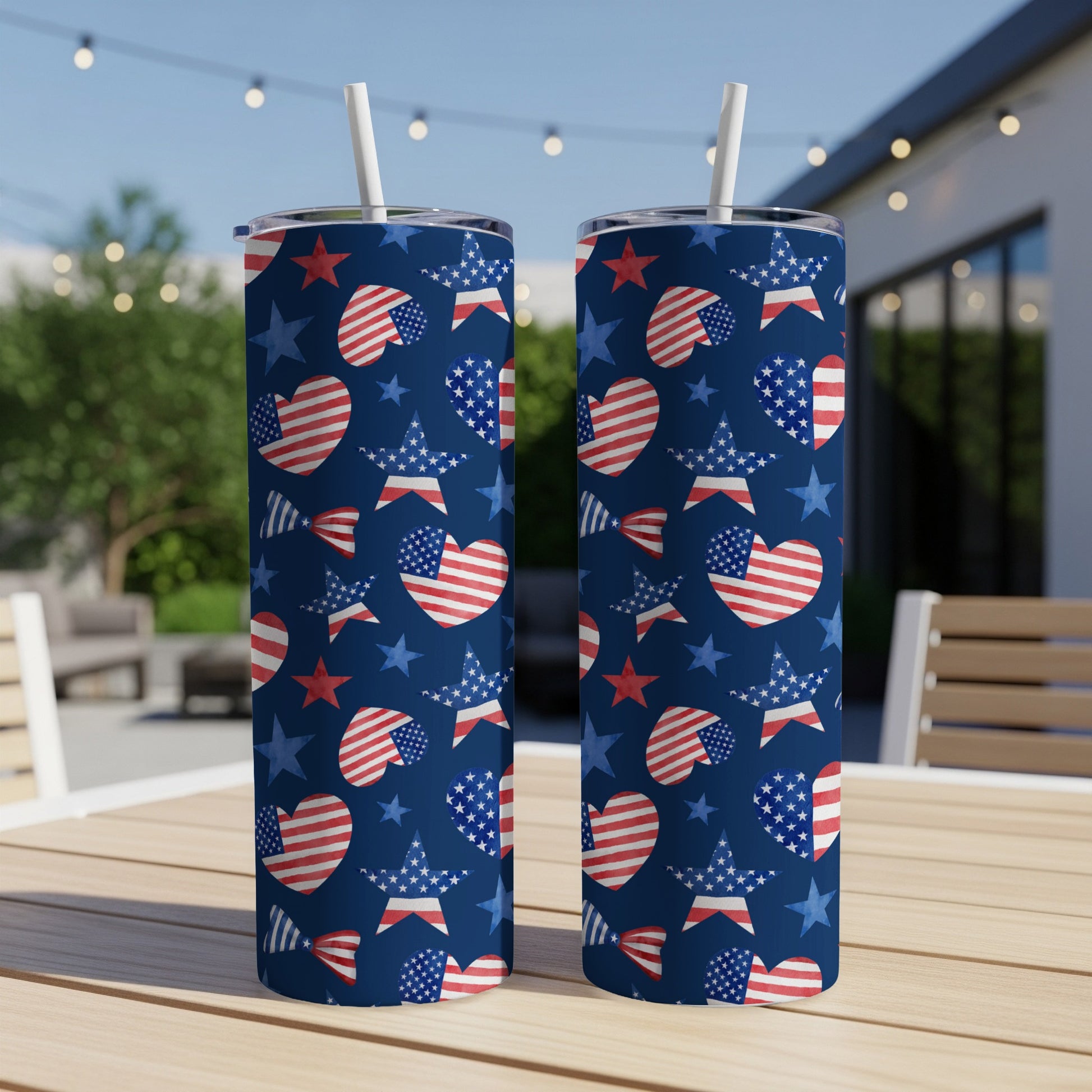 Two navy blue tumblers with red and white stars and hearts pattern.