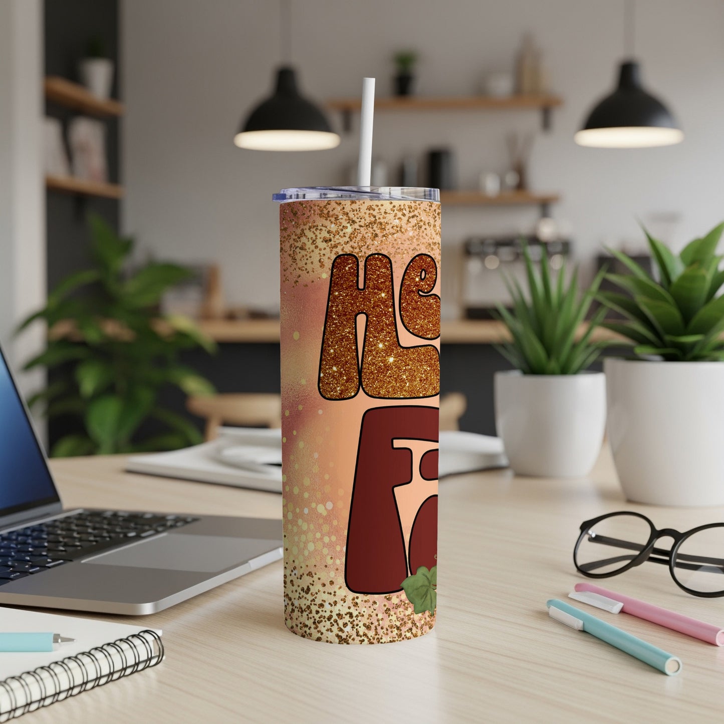 Glittery tumbler with "He is Risen" text and floral accents.
