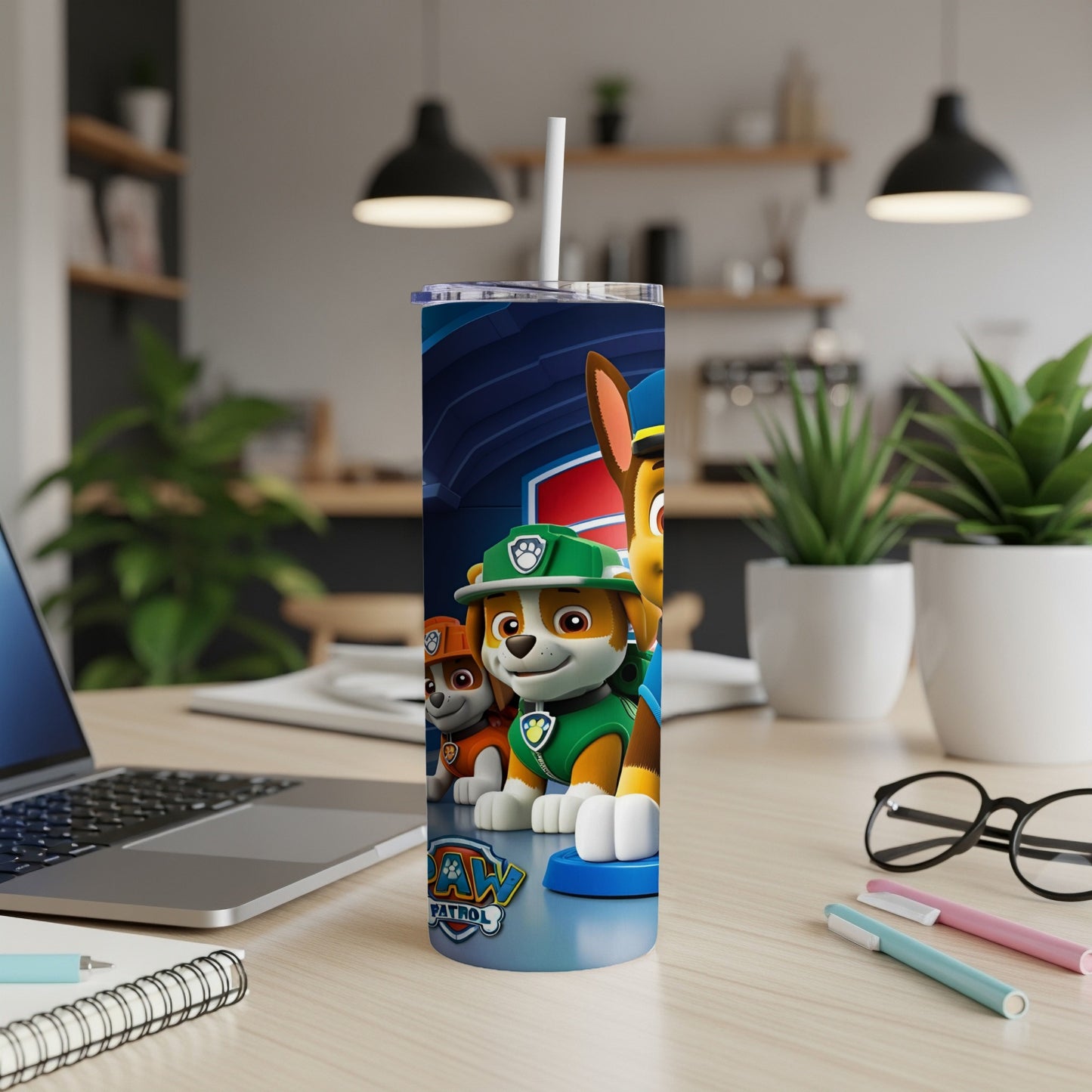 Paw Patrol characters Ryder and Chase on a blue and white tumbler.