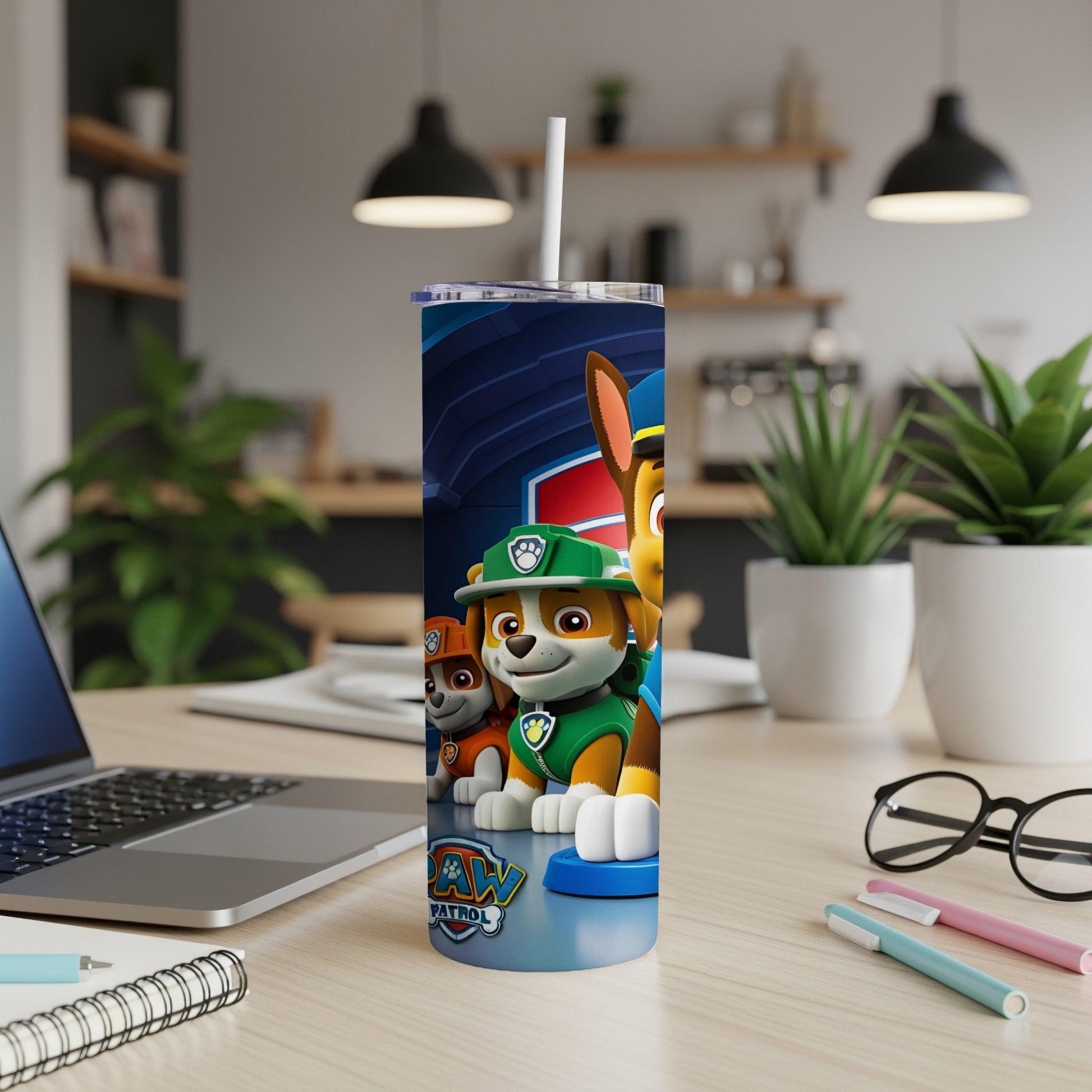 Paw Patrol characters Ryder and Chase on a blue and white tumbler.
