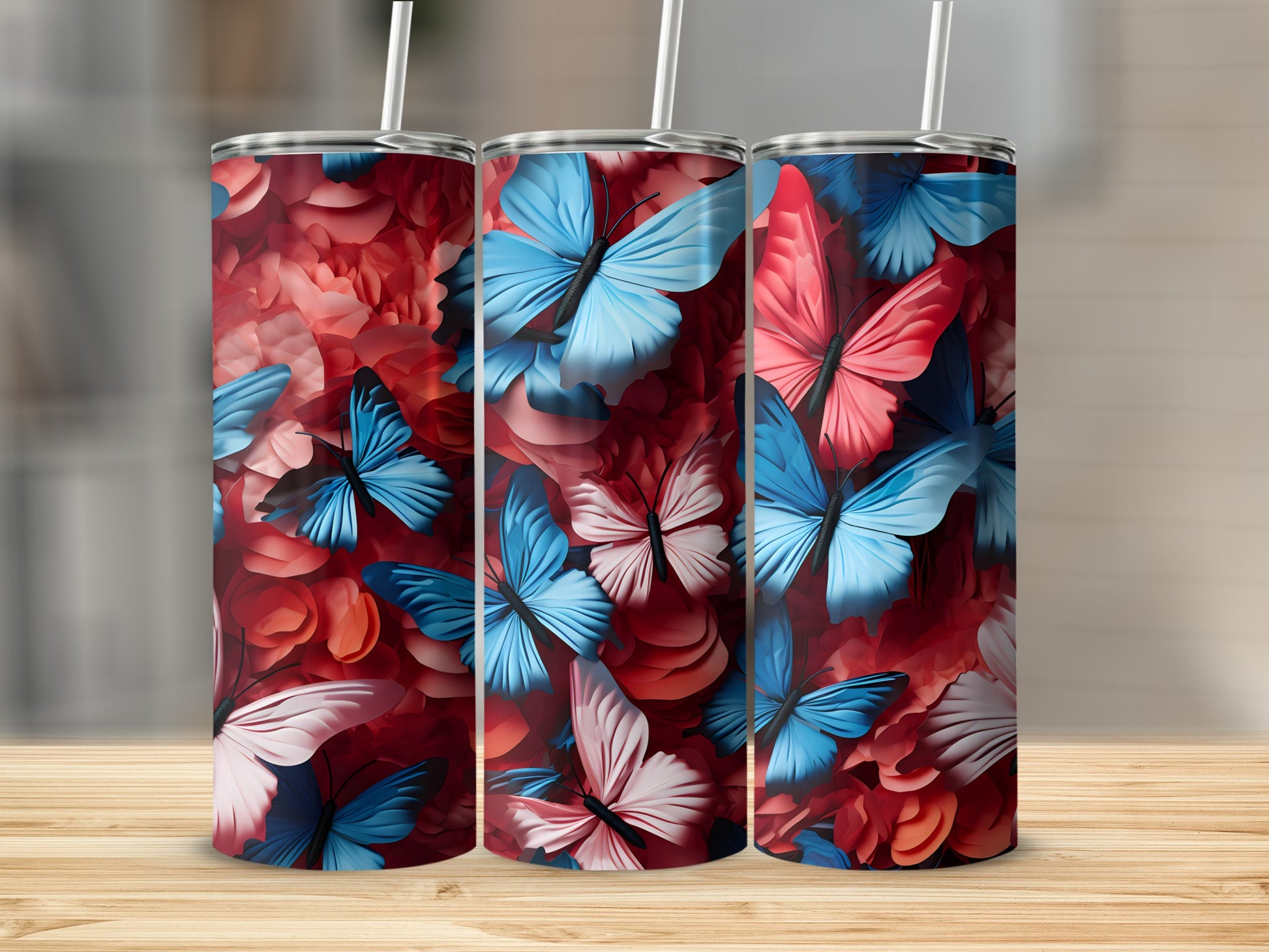 Three tumblers with a floral and butterfly design.