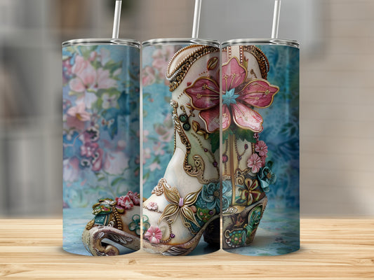 Tall floral boot tumbler with ornate details and a straw.