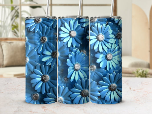 Blue floral pattern on three tumblers with straws.
