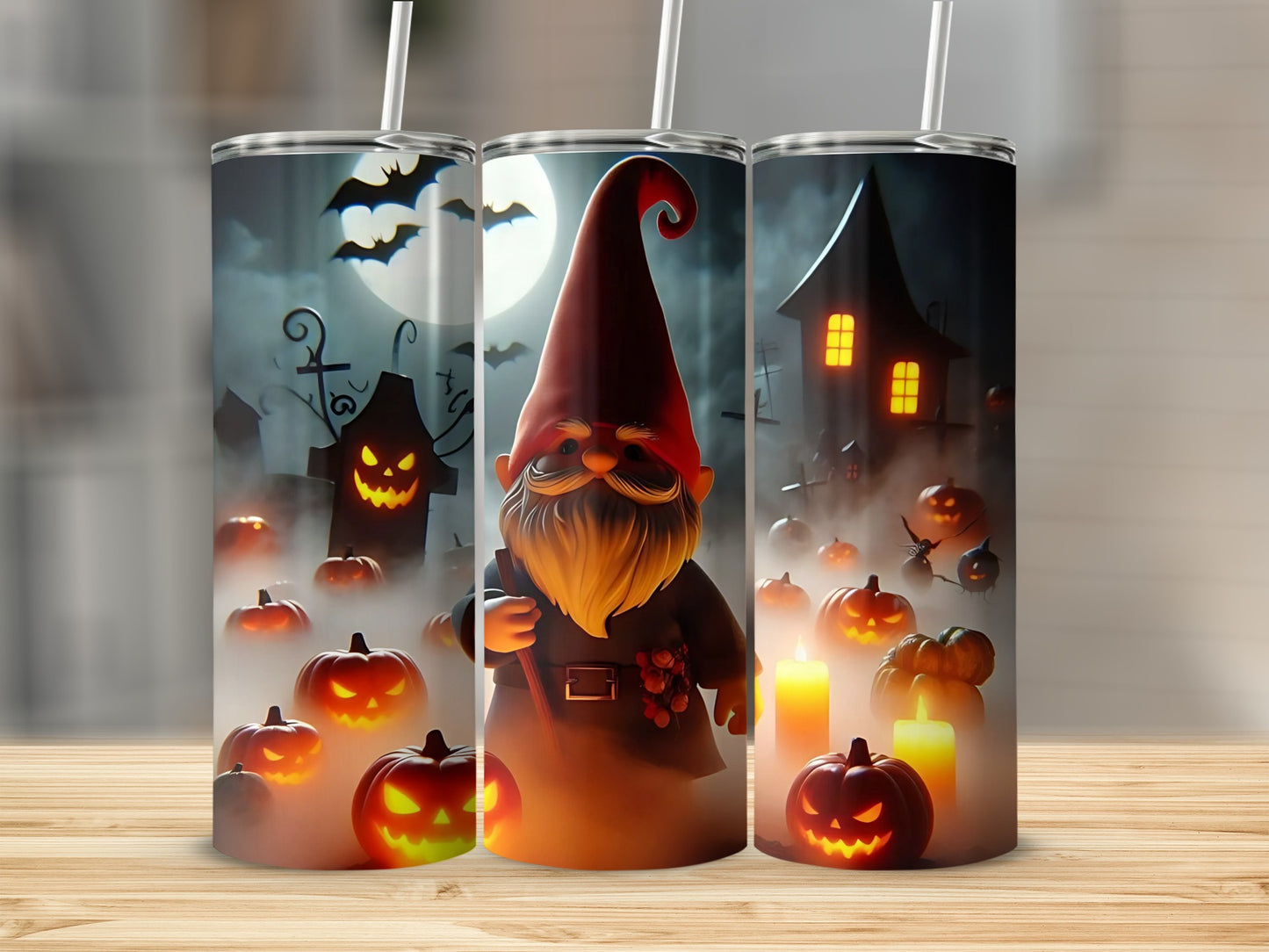 Three tumblers featuring a Halloween theme with a gnome, pumpkins, bats, and a haunted house.