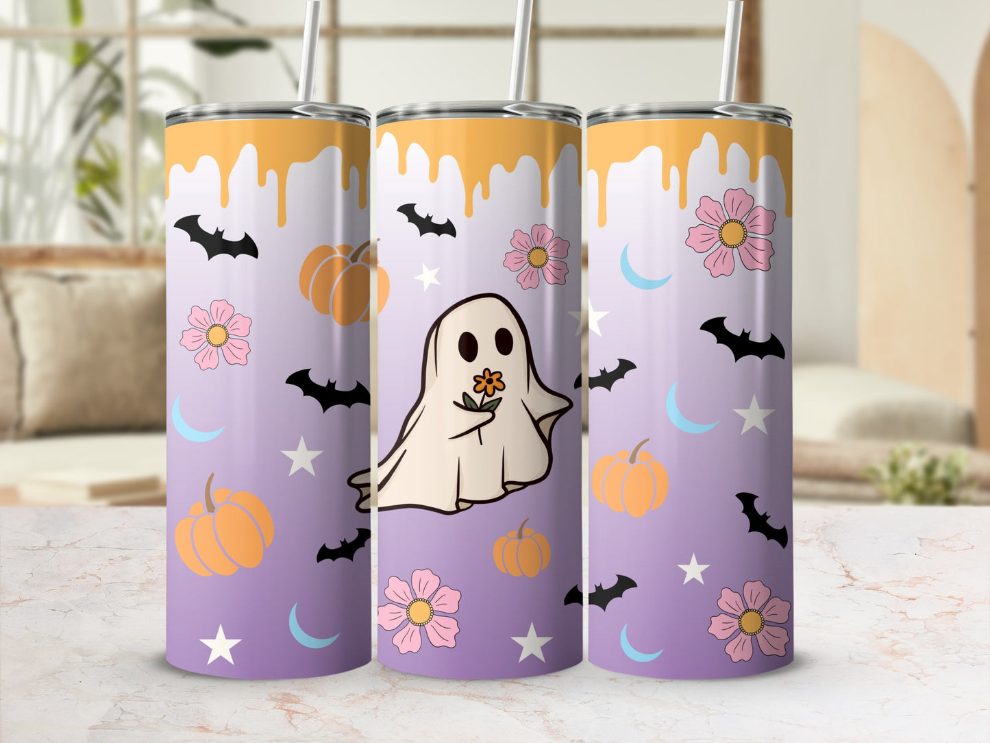 Three tumblers with a purple gradient and a Halloween design featuring ghosts, pumpkins, and bats.
