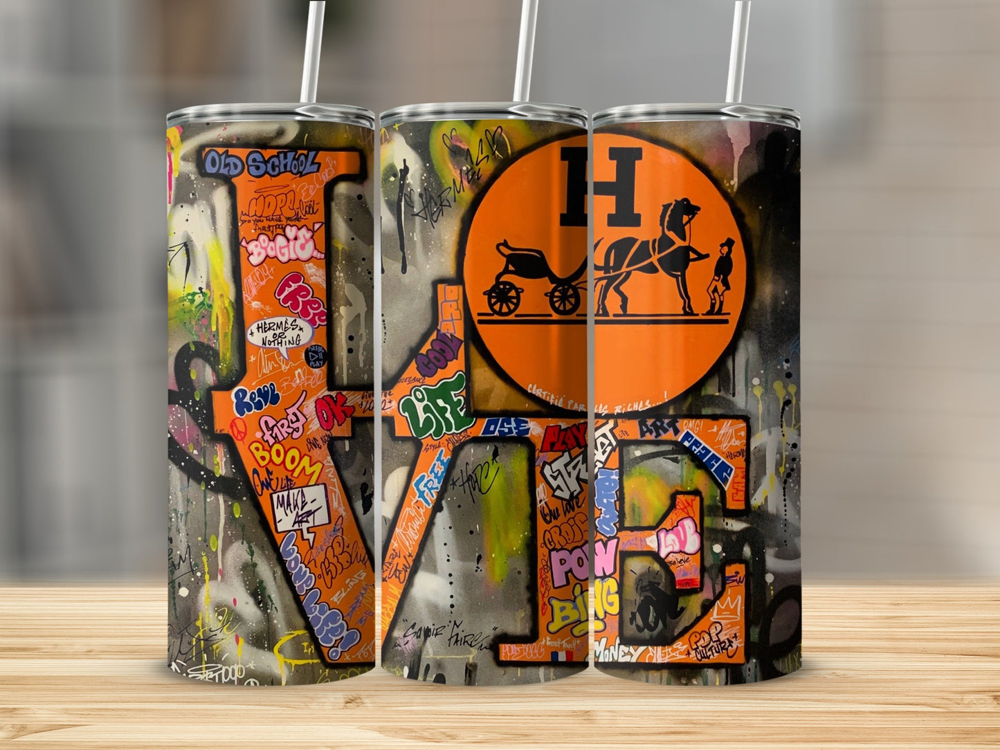 Three tumblers with graffiti art spelling "LOVE" and the Hermes horse logo.