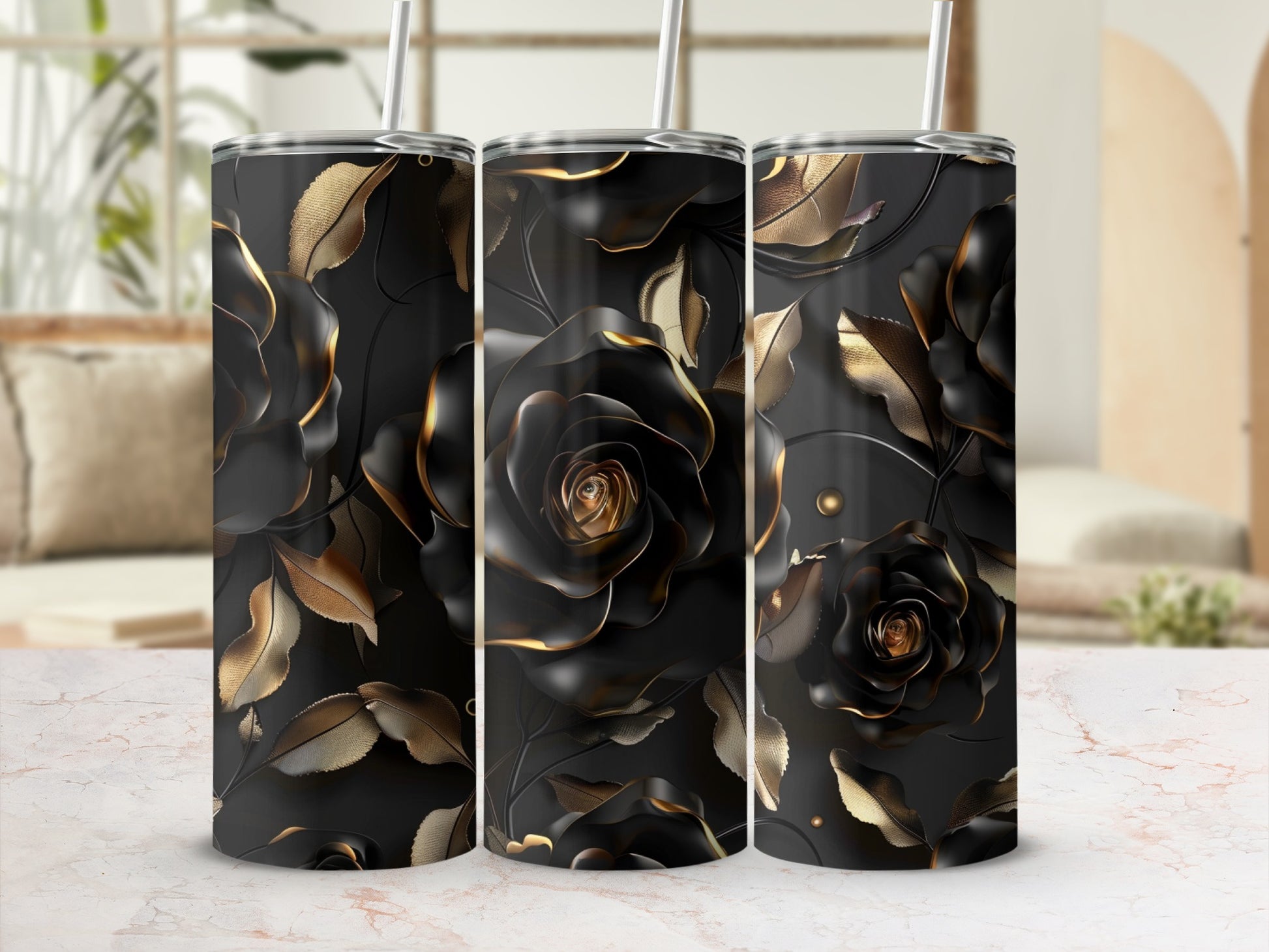 Three black tumblers with gold rose and leaf pattern.