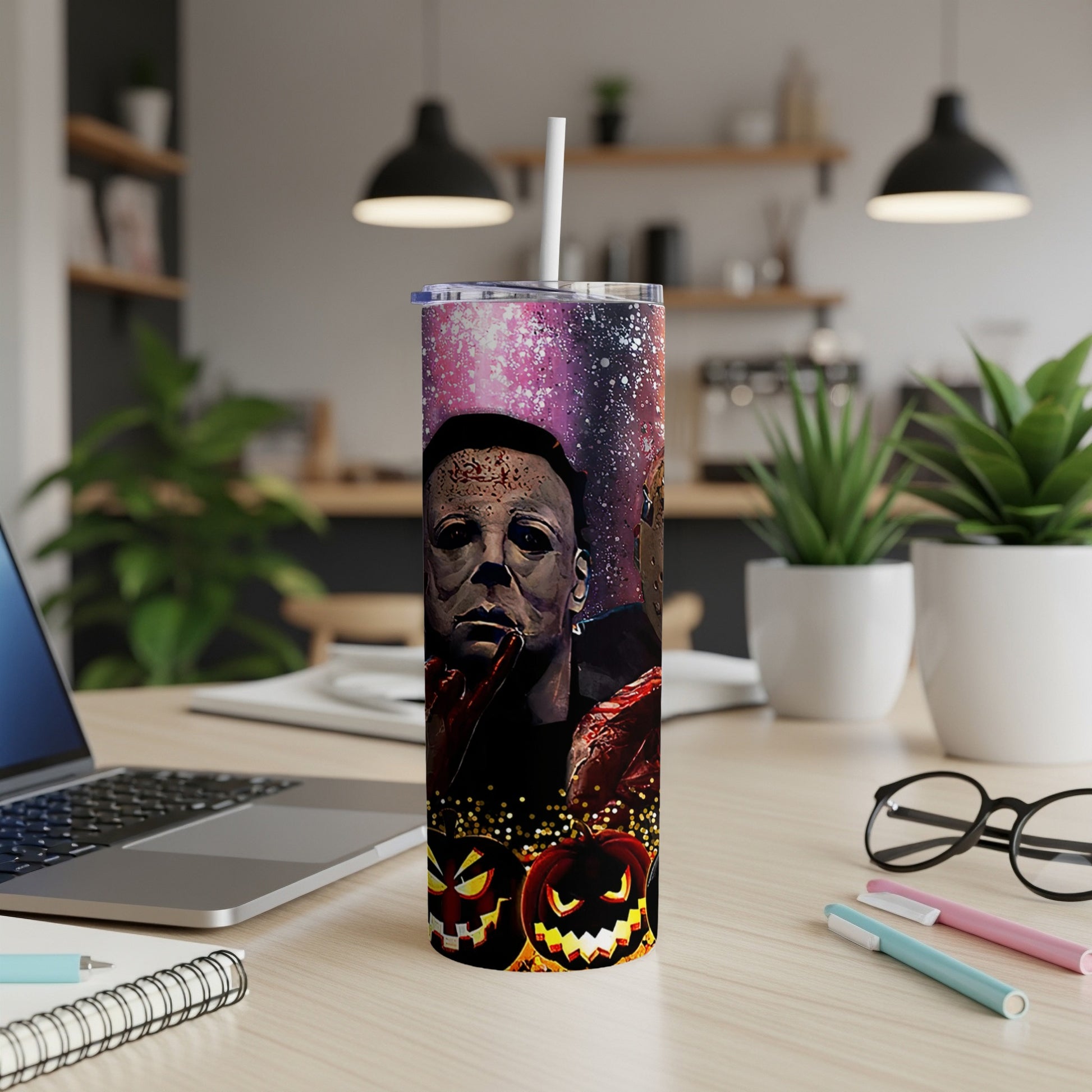 Michael Myers and Jack-o'-lanterns adorn a tall tumbler with a starry background.