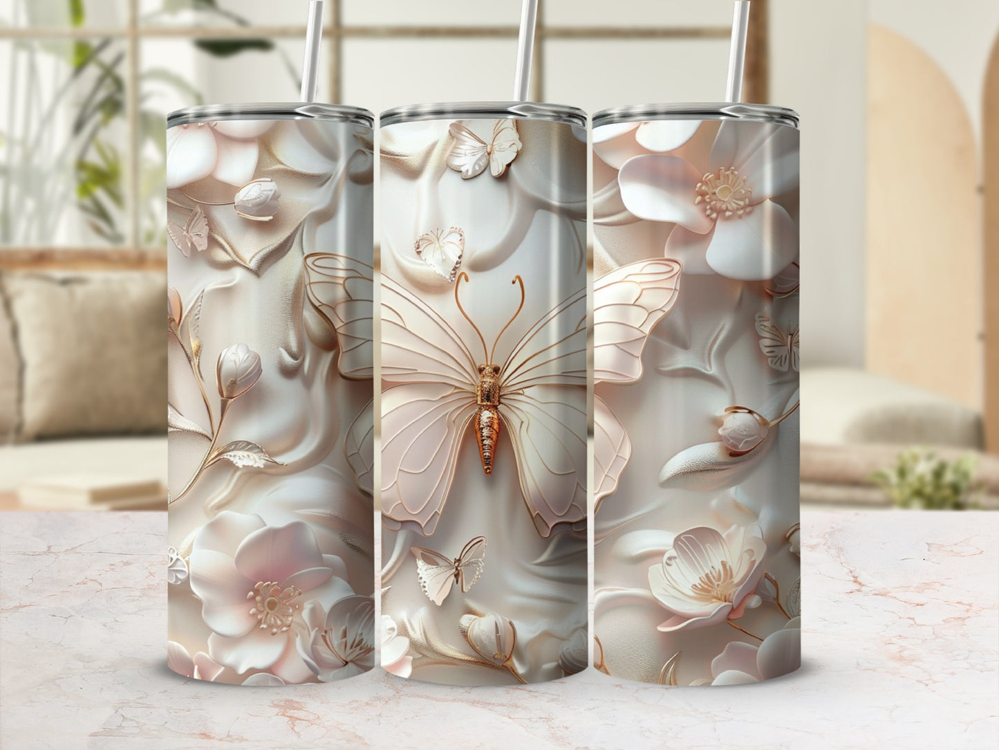 Triptych of tumblers featuring embossed butterflies and floral designs.