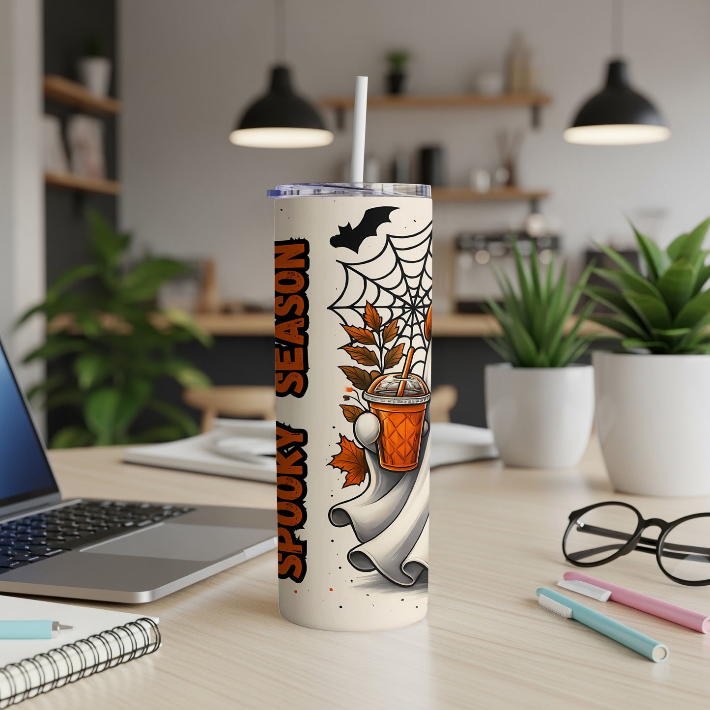 Tumbler with "Spooky Season" text, ghost, bat, and autumn leaves design.