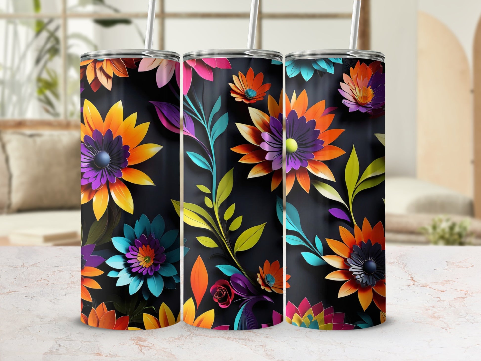 Three tumblers with a vibrant floral design on a black background.