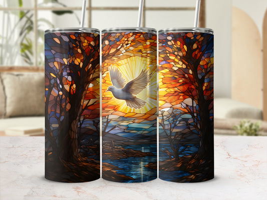 Three stained-glass tumblers with a dove flying through a vibrant forest.