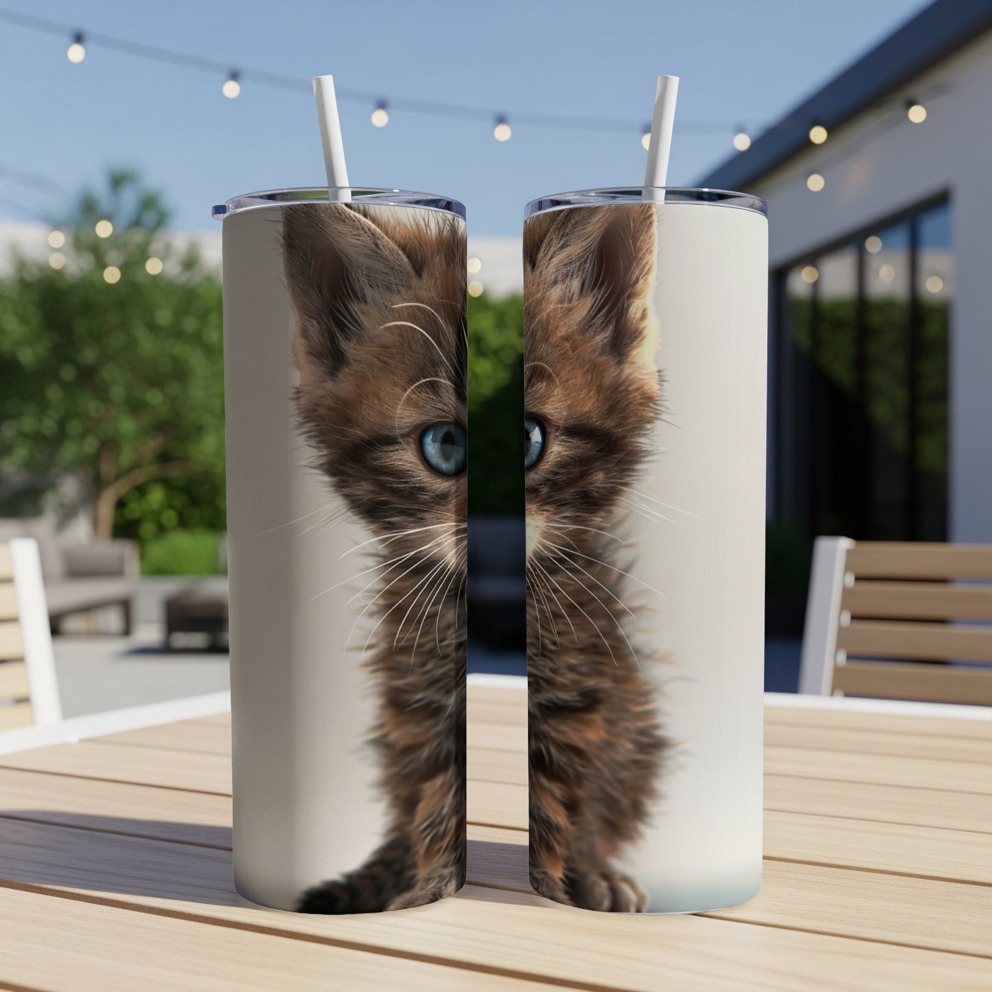 Two matching tumblers with a close-up of a fluffy kitten's face.