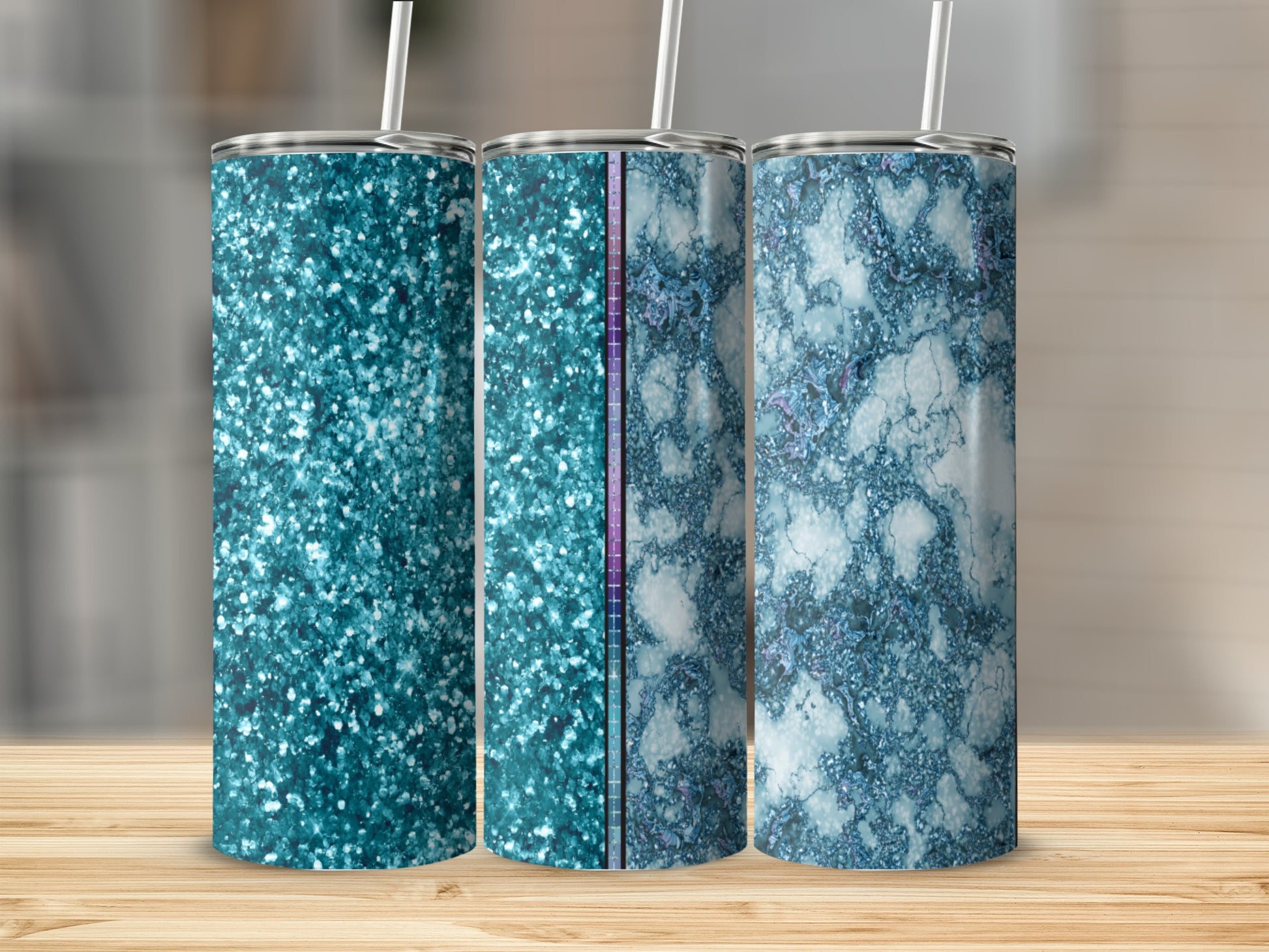 Three glitter and marble patterned tumblers with straws.