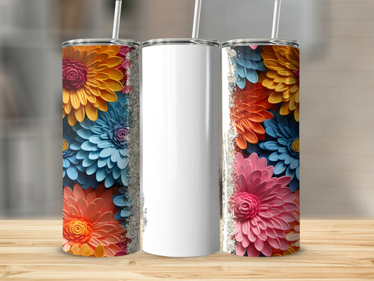 Three floral-patterned tumblers with glitter accents on a wooden surface.