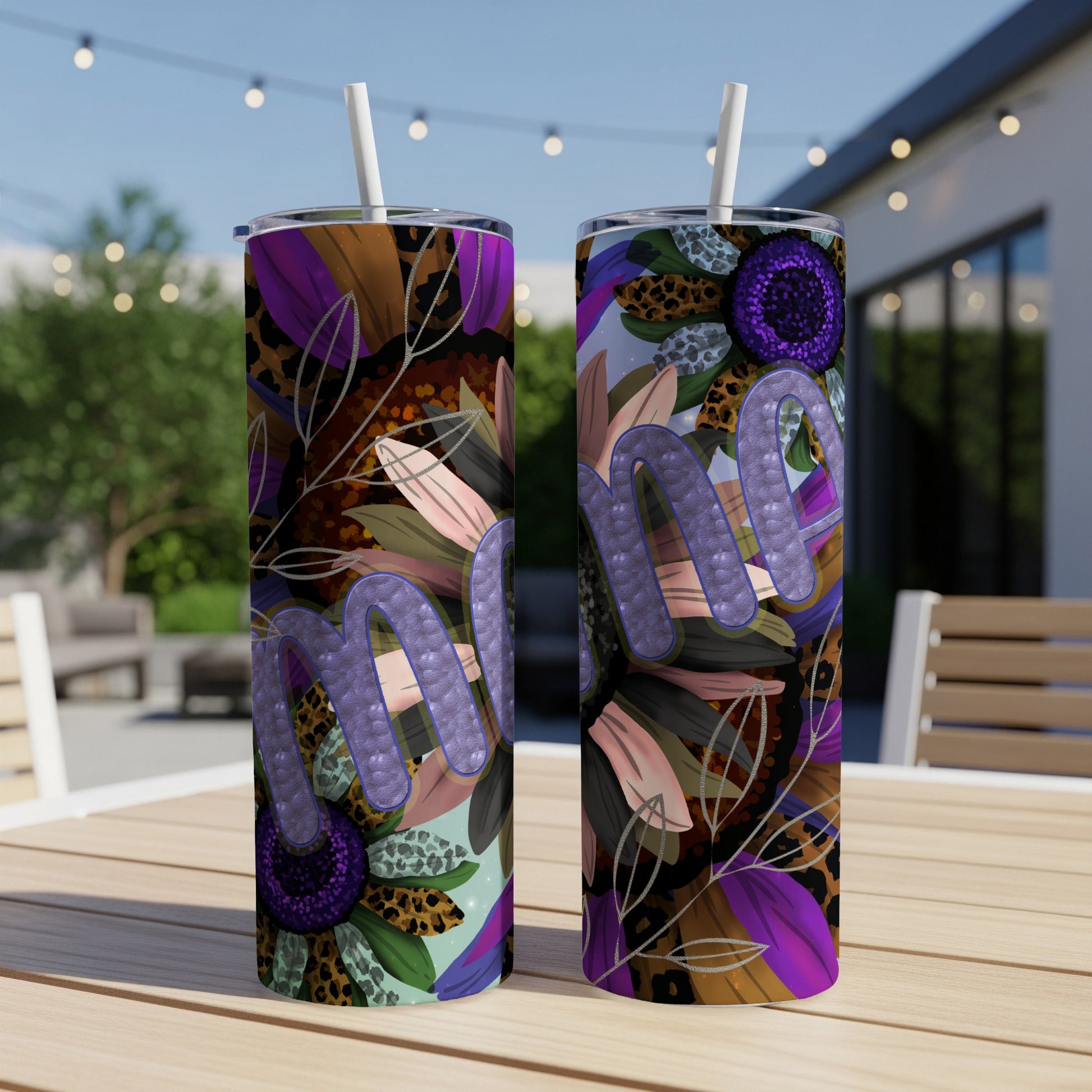 Two tumblers with purple glitter "mama" design and floral leopard print.