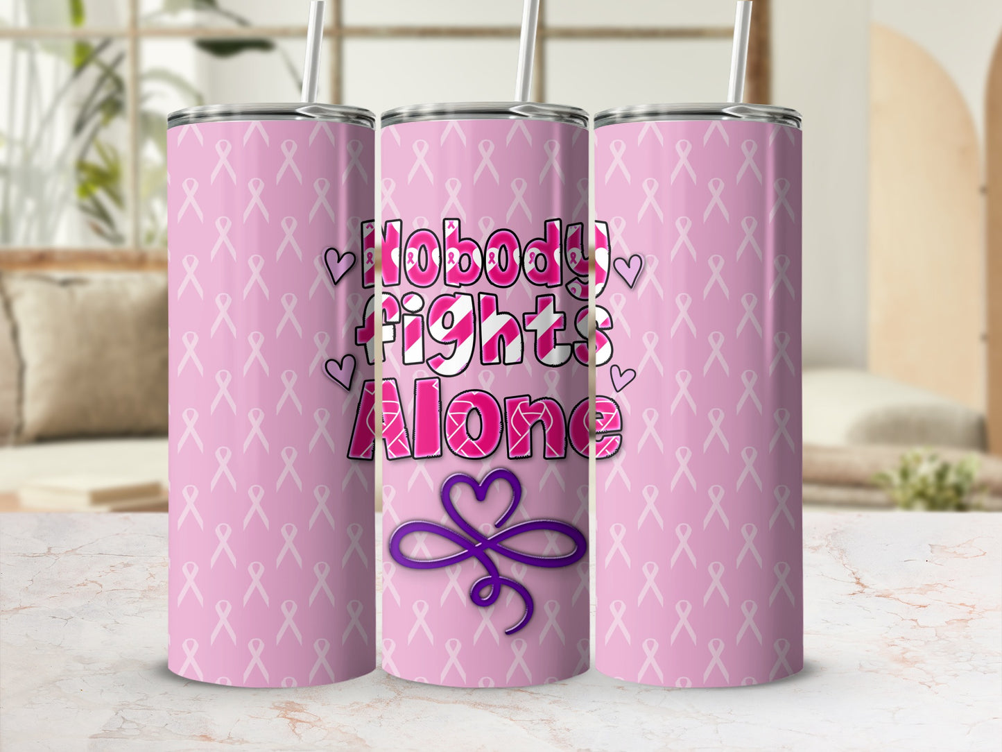 Pink tumbler with "Nobody Fights Alone" text and a purple ribbon design.