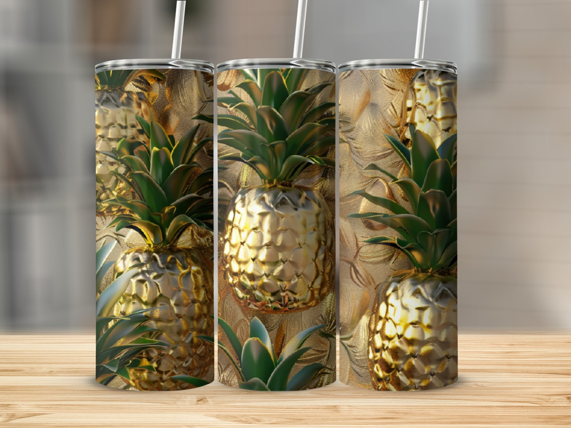 Three tumblers with a textured gold pineapple design and white straws.