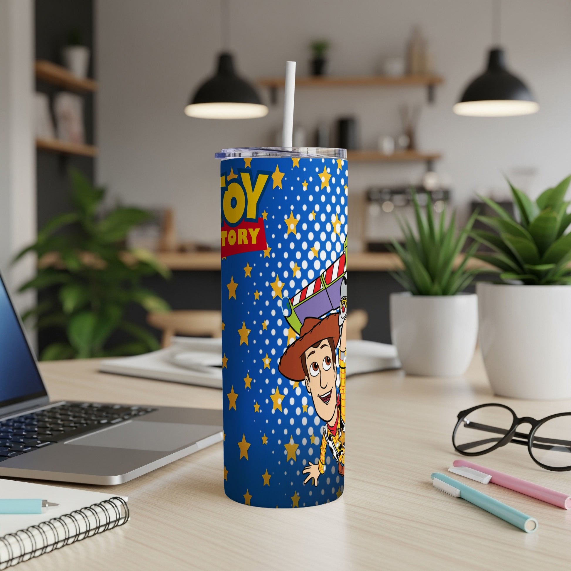 Woody and Buzz Lightyear on a blue Toy Story tumbler with stars and confetti.