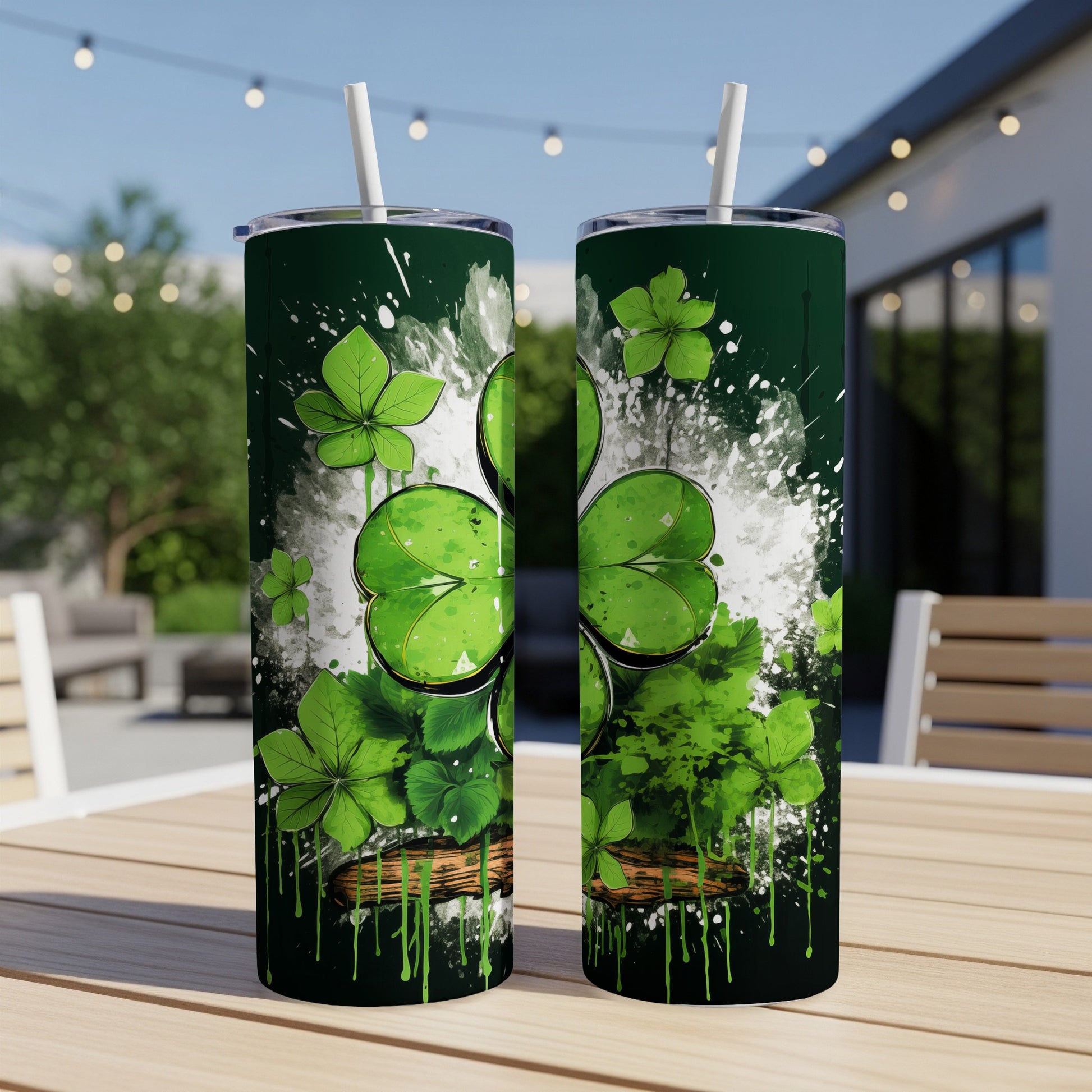 Two green tumblers with shamrock and paint splash design.