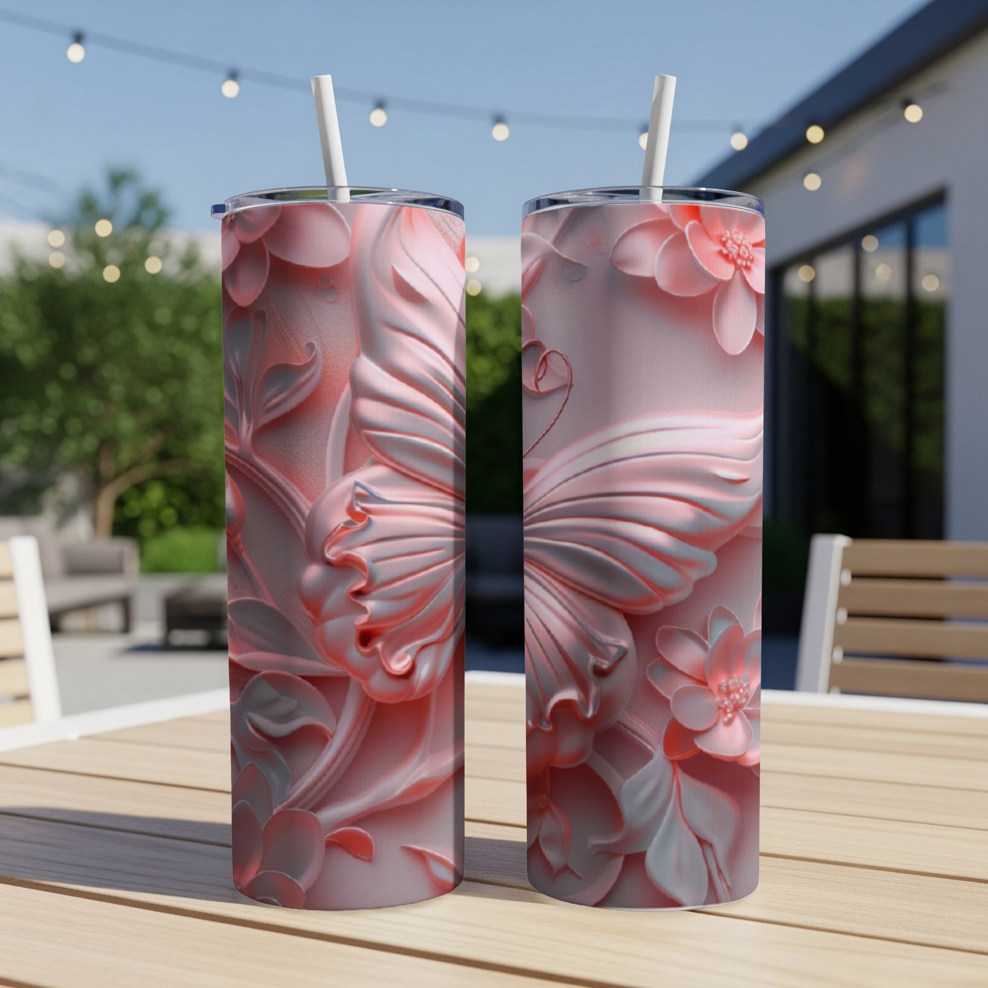 Two pink tumblers with a raised butterfly and floral design.