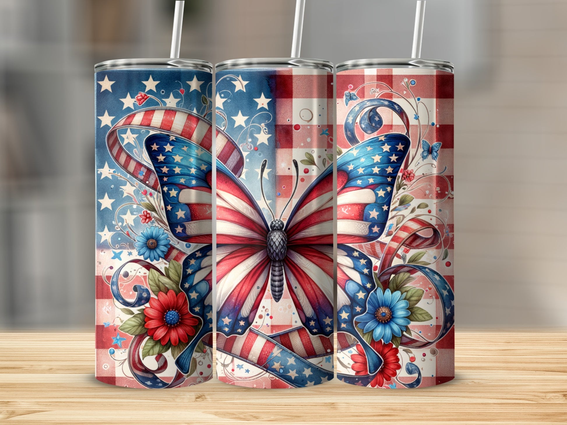 Three tumblers with patriotic butterfly and floral designs.
