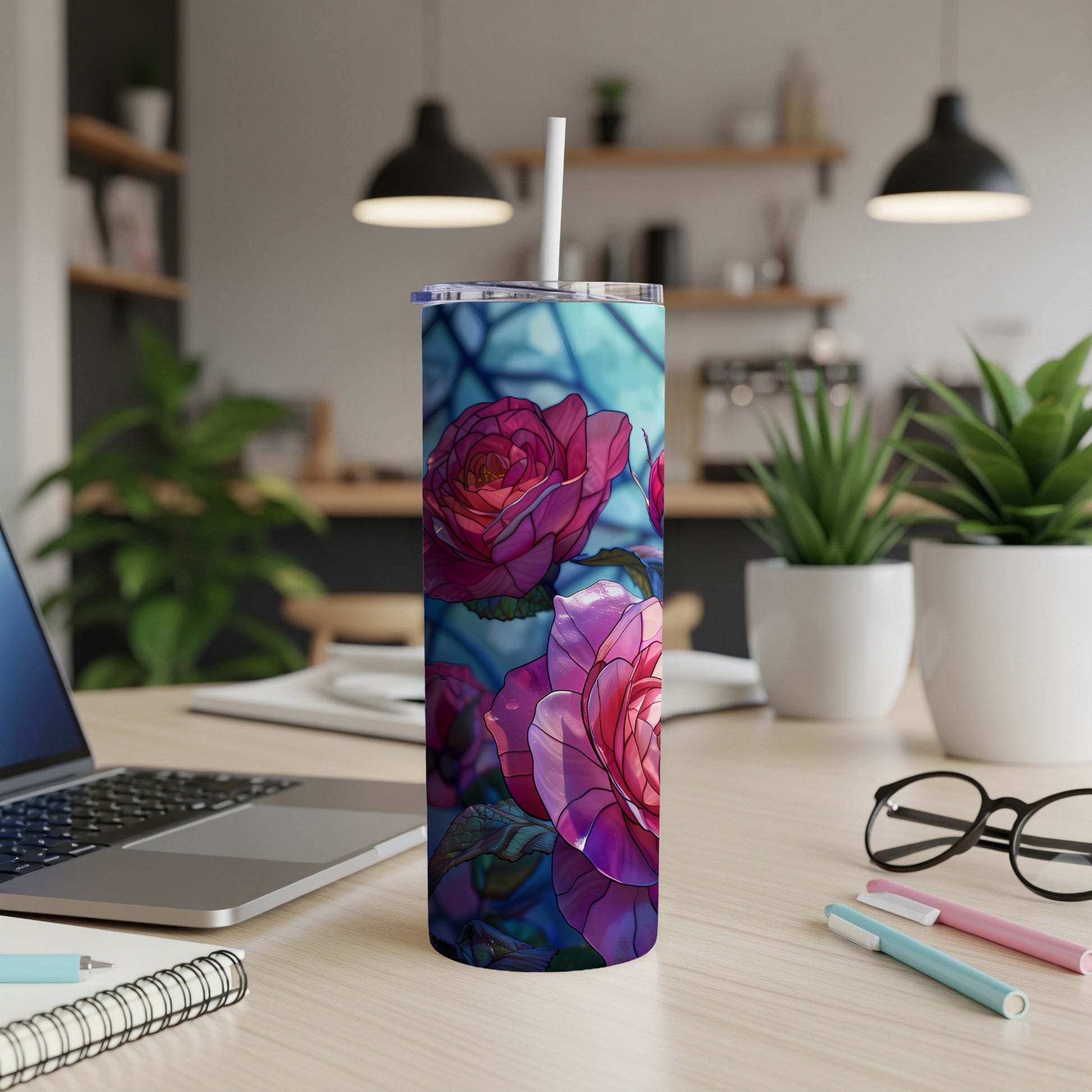 Tumbler with stained-glass style pink roses and blue geometric background.