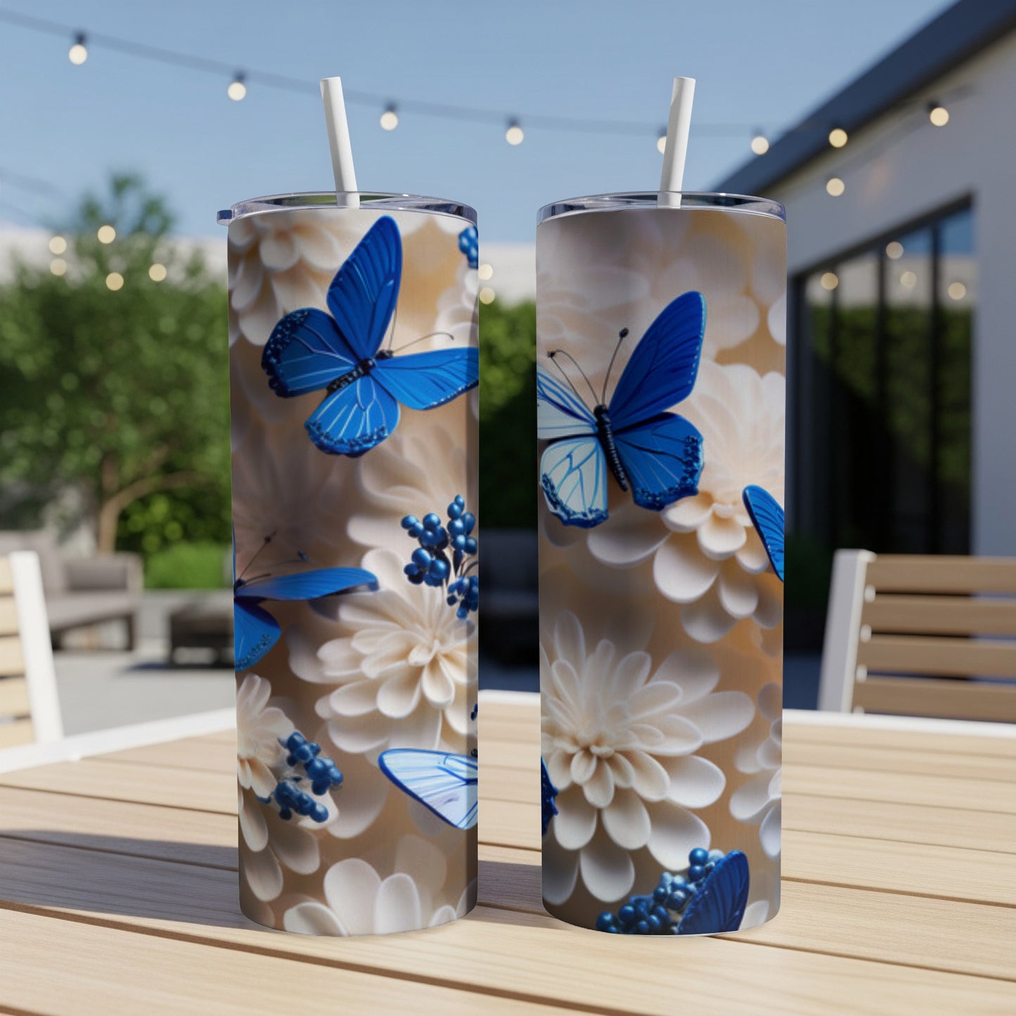 Two tall tumblers with blue butterflies and white floral design.