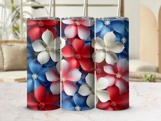 Three tumblers with red, white, and blue floral pattern and straws.