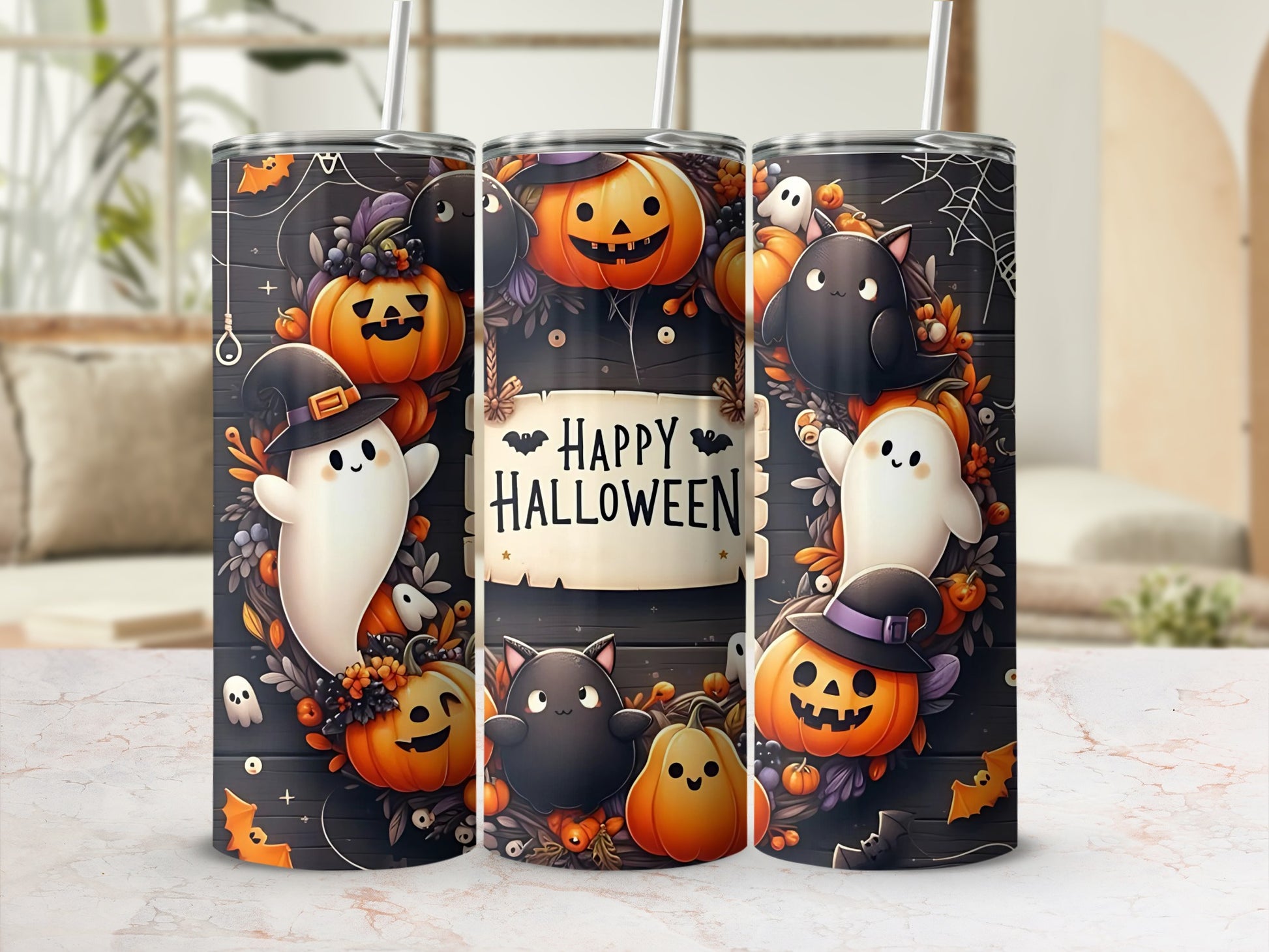 Three Halloween themed tumblers with ghosts, pumpkins, and bats.